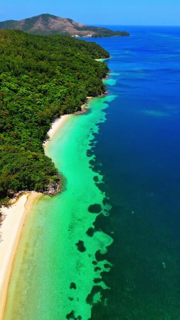 Aerial view of the lush coastline and beaches of Guanaja Honduras. Aerial view of the lush coastline and beaches of Guanaja Honduras.