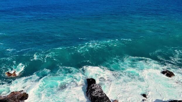 Aerial view of waves crashing at Kalaemamo United States.