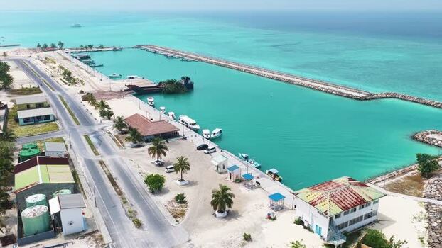 Aerial view of a harbor with boats and turquoise water Maldives. Aerial view of a harbor with boats and turquoise water Maldives.