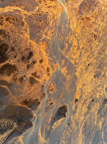 Aerial view of braided river channels in the volcanic landscape of Iceland. Aerial view of braided river channels in the volcanic landscape of Iceland.