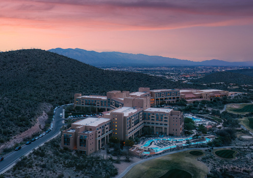 Tucson United States 05 May 2021 Aerial view of JW Marriott Tucson Starr Pass Resort and Spa in the desert landscape with swimming pools and mountain backdrop under a sunset sky. Tucson United States 05 May 2021 Aerial view of JW Marriott Tucson Starr Pass Resort and Spa in the desert landscape with swimming pools and mountain backdrop under a sunset sky.
