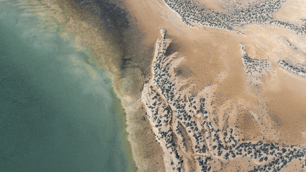 Aerial view of turquoise waters and intricate sand patterns along the coastline of Denham Western Australia Australia. Aerial view of turquoise waters and intricate sand patterns along the coastline of Denham Western Australia Australia.