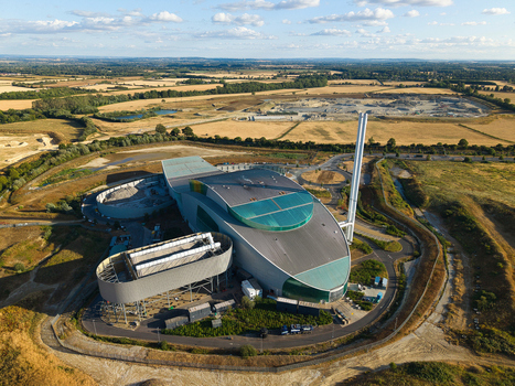 Aerial view of the Energy Recovery Facility with modern architecture and tall chimney situated amidst rural fields and open landscape in Bicester England United Kingdom.