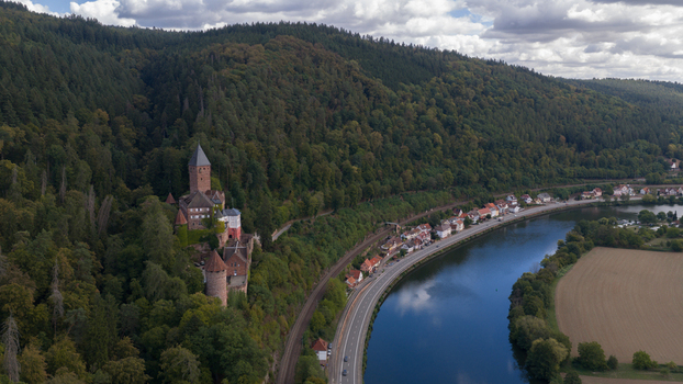Aerial view of Zwingenberg Castle perched on a forested hillside overlooking the Neckar River and the town of Zwingenberg Baden Wurttemberg Germany. Aerial view of Zwingenberg Castle perched on a forested hillside overlooking the Neckar River and the town of Zwingenberg Baden Wurttemberg Germany.