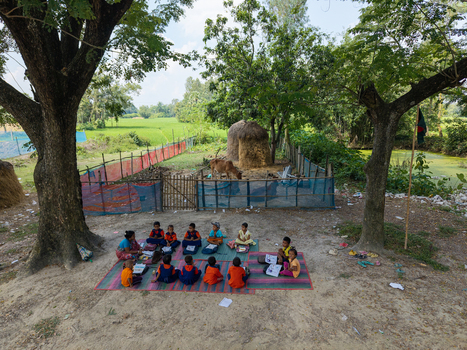 Joypurhat Bangladesh 22 September 2026 Aerial view of a group of children attending an outdoor class on mats under the shade of trees in a rural village. Joypurhat Bangladesh 22 September 2026 Aerial view of a group of children attending an outdoor class on mats under the shade of trees in a rural village.