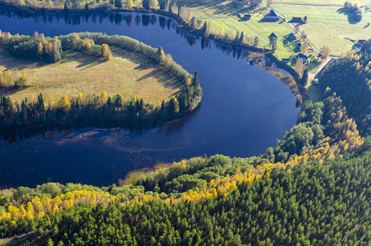 Aerial view of the Klaralven river winding through the autumn forests and fields of Varmlands lan Sweden. Aerial view of the Klaralven river winding through the autumn forests and fields of Varmlands lan Sweden.