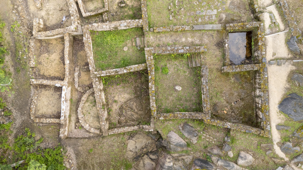 Aerial view of Castro de Armea archaeological site featuring ancient stone foundations and green vegetation in Allariz Province of Ourense Spain. Aerial view of Castro de Armea archaeological site featuring ancient stone foundations and green vegetation in Allariz Province of Ourense Spain.
