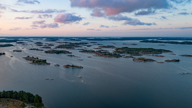 Aerial view of the archipelago surrounding Oro Fortress Island with rocky islets calm water and soft sunset light in Oro Varsinais Suomi Finland. Aerial view of the archipelago surrounding Oro Fortress Island with rocky islets calm water and soft sunset light in Oro Varsinais Suomi Finland.