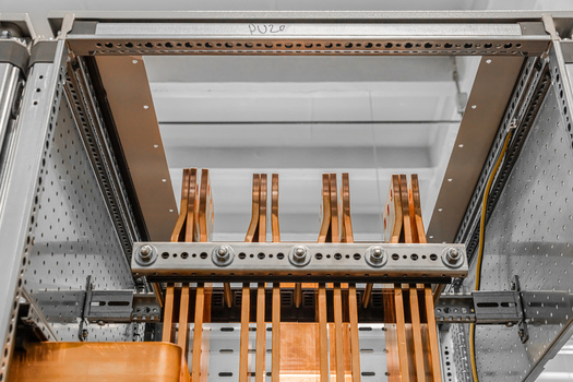 View of copper busbars installed in an electrical switchgear cabinet in Latvia. View of copper busbars installed in an electrical switchgear cabinet in Latvia.