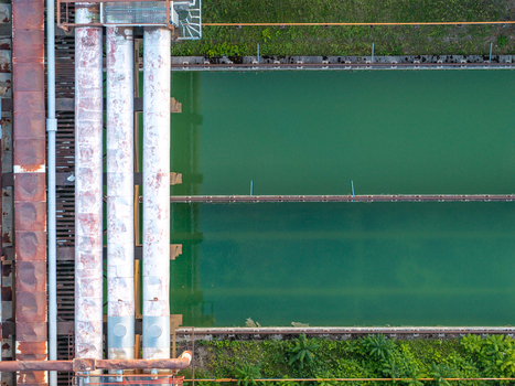 Aerial view of the industrial pipes and green water pools at the Heizkraftwerk Klingenberg combined heat and power plant in Berlin Berlin Germany. Aerial view of the industrial pipes and green water pools at the Heizkraftwerk Klingenberg combined heat and power plant in Berlin Berlin Germany.