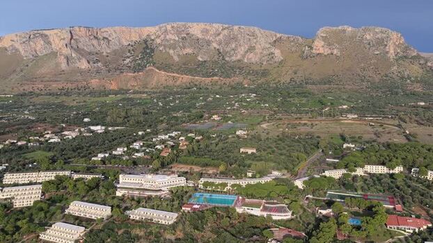 Aerial view of resort complex with swimming pool in Terrasini Italy.