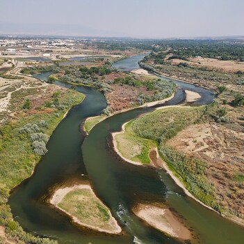 Aerial view of the Colorado River showing low water levels and smokey haze during a severe drought near Grand Junction Colorado United States. Aerial view of the Colorado River showing low water levels and smokey haze during a severe drought near Grand Junction Colorado United States.