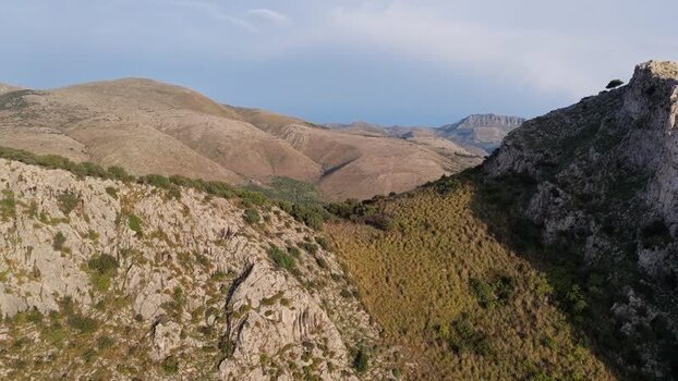 Aerial view of the rugged rocky hills in Terrasini Italy.