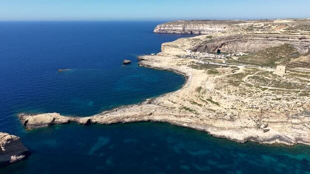 Aerial view of Dwejra Bay and the rugged coastline Malta. Aerial view of Dwejra Bay and the rugged coastline Malta.
