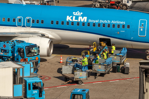 Schiphol Netherlands 16 April 2026 View of ground crew loading luggage into a KLM Royal Dutch Airlines airplane on the tarmac at Schiphol Airport. Schiphol Netherlands 16 April 2026 View of ground crew loading luggage into a KLM Royal Dutch Airlines airplane on the tarmac at Schiphol Airport.
