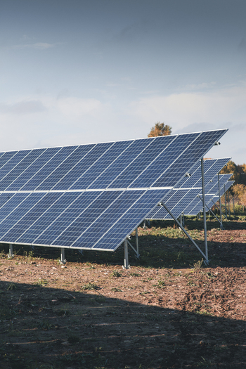 View of solar panels installed in a field under a clear blue sky in Tartu County Estonia. View of solar panels installed in a field under a clear blue sky in Tartu County Estonia.