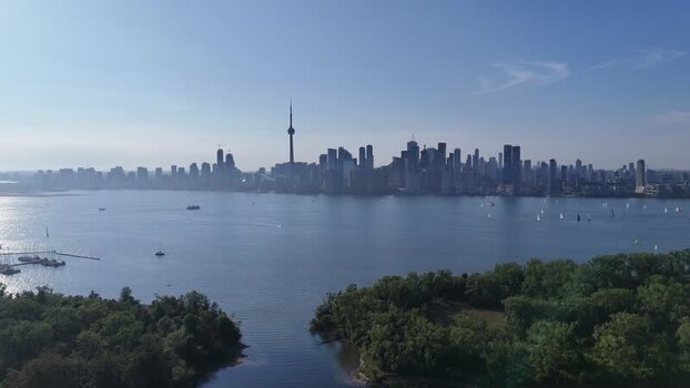 Aerial view of CN Tower and Toronto skyline across Lake Ontario Canada. Aerial view of CN Tower and Toronto skyline across Lake Ontario Canada.