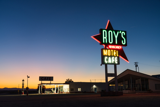 Amboy United States 07 April 2026 View of Roy s Motel and Cafe s vibrant neon lights pierce the twilight sky casting a retro glow over the historic Route 66 landmark. Amboy United States 07 April 2026 View of Roy s Motel and Cafe s vibrant neon lights pierce the twilight sky casting a retro glow over the historic Route 66 landmark.