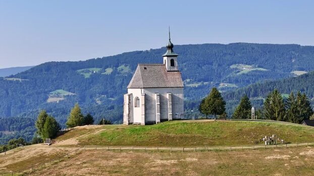 Aerial view of Wolfgangikirche on a hill in Schwanberg Austria. Aerial view of Wolfgangikirche on a hill in Schwanberg Austria.
