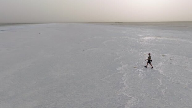 Aerial view of a person walking on the Danakil Salt Lake Ethiopia. Aerial view of a person walking on the Danakil Salt Lake Ethiopia.