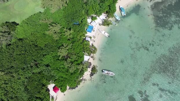 Aerial view of Ile aux Cerfs beach and boats Mauritius.