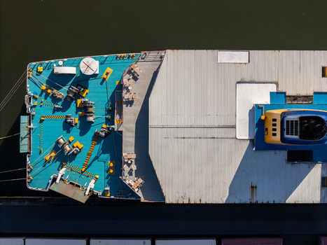 Aerial view of the deck of a ship on the Rio Ozama showing winches ropes and a corrugated metal roof in Santo Domingo Santo Domingo Dominican Republic.