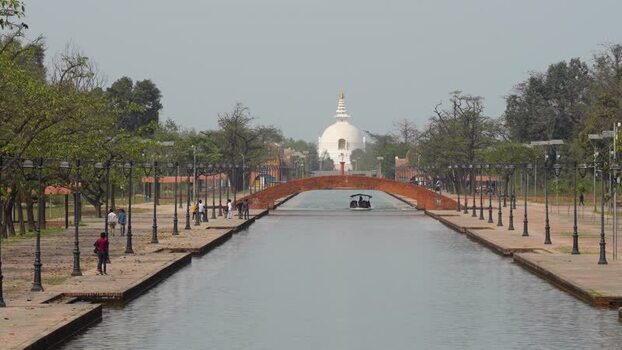 View of the World Peace Pagoda and central canal in Lumbini Nepal.