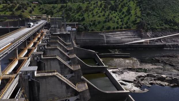 Aerial view of a large hydroelectric dam and green hills Portugal. Aerial view of a large hydroelectric dam and green hills Portugal.