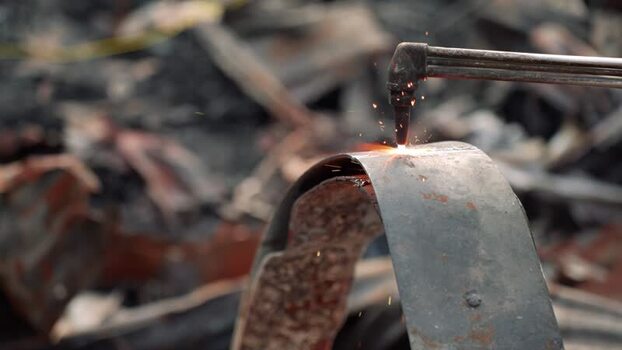 View of a gas torch cutting metal with bright sparks Bangladesh. View of a gas torch cutting metal with bright sparks Bangladesh.