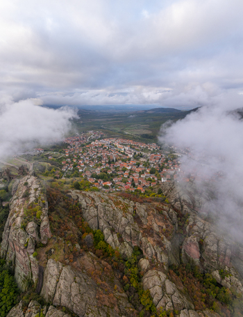 Aerial view of the Belogradchik Rocks with the town of Belogradchik nestled among the unique sandstone formations under a cloudy sky in Belogradchik Vidin Bulgaria. Aerial view of the Belogradchik Rocks with the town of Belogradchik nestled among the unique sandstone formations under a cloudy sky in Belogradchik Vidin Bulgaria.