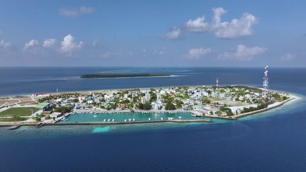 Aerial view of the island town and harbor Maldives. Aerial view of the island town and harbor Maldives.