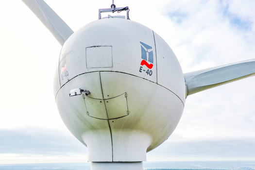 Simmerath Germany 09 May 2026 Aerial view of an Enercon E 40 wind turbine nacelle and hub against a bright cloudy sky. Simmerath Germany 09 May 2026 Aerial view of an Enercon E 40 wind turbine nacelle and hub against a bright cloudy sky.