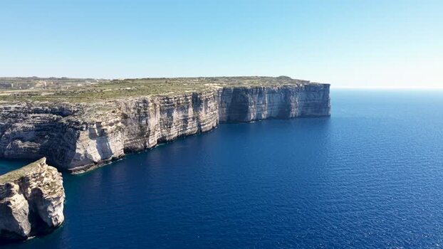 Aerial view of the high limestone cliffs at Dwejra Bay Malta. Aerial view of the high limestone cliffs at Dwejra Bay Malta.