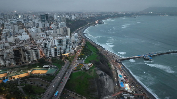 Aerial view of Love Park situated on the coastal cliffs overlooking the Pacific Ocean with the urban skyline and highway in Miraflores Provincia de Lima Peru. Aerial view of Love Park situated on the coastal cliffs overlooking the Pacific Ocean with the urban skyline and highway in Miraflores Provincia de Lima Peru.