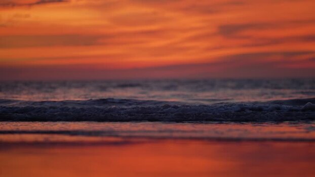 View of sunset over the waves at Cox s Bazar beach Bangladesh. View of sunset over the waves at Cox s Bazar beach Bangladesh.