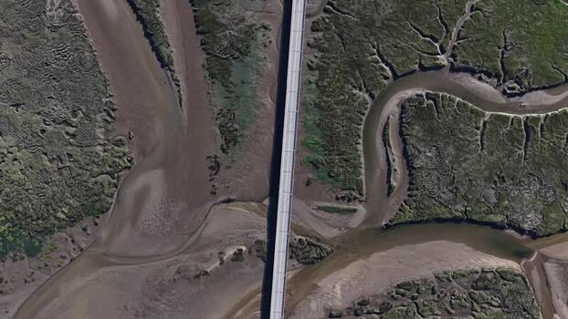 Aerial view of river and bridge over a estuary wetland Portugal. Aerial view of river and bridge over a estuary wetland Portugal.