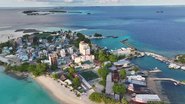 Aerial view of the tropical island of Gulhi with its harbor Maldives. Aerial view of the tropical island of Gulhi with its harbor Maldives.