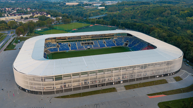 Plock Mazowieckie Poland 10 September 2026 Aerial view of Orlen Stadion im. Kazimierza Gorskiego with its modern white roof blue seating and surrounding green landscape.
