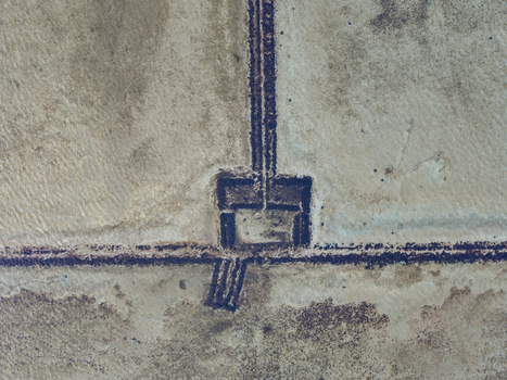 Aerial view of the geometric patterns and dark channels of Salt Pond with sandy textures in Exuma Exuma The Bahamas.