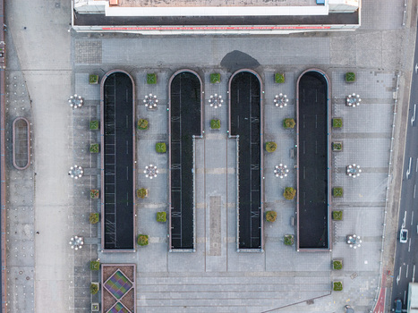 Aerial view of the Internationales Congress Centrum showcasing its distinctive Brutalist architecture geometric concrete structures and surrounding paved plazas in Berlin Berlin Germany. Aerial view of the Internationales Congress Centrum showcasing its distinctive Brutalist architecture geometric concrete structures and surrounding paved plazas in Berlin Berlin Germany.