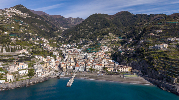 Aerial view of the town nestled between the sea and the mountains a vibrant mix of colors and textures under a bright sky Minori Campania Italy. Aerial view of the town nestled between the sea and the mountains a vibrant mix of colors and textures under a bright sky Minori Campania Italy.