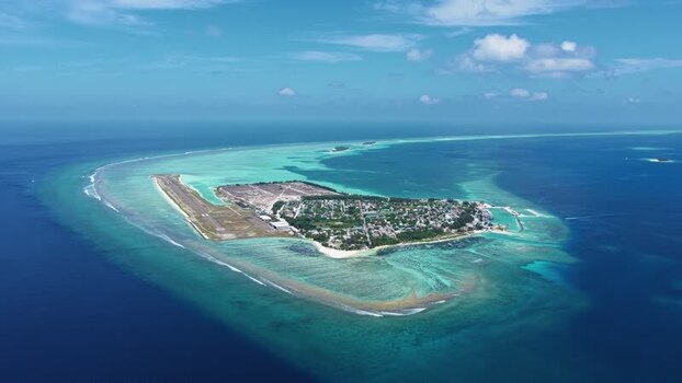 Aerial view of Kudahuvadhoo island and airport Maldives.