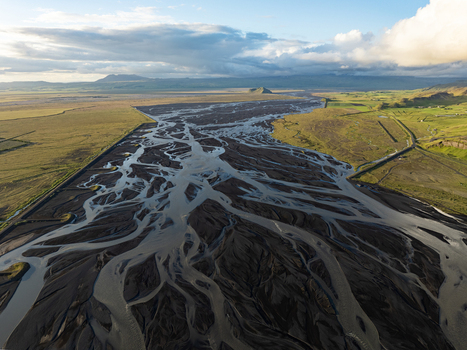 Aerial view of a braided river flowing through the volcanic landscape of Rangarthing eystra Iceland. Aerial view of a braided river flowing through the volcanic landscape of Rangarthing eystra Iceland.