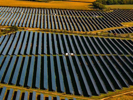 Aerial view of Chelveston Renewable Energy BESS featuring extensive rows of photovoltaic solar panels arranged in a rural landscape in Chelveston England United Kingdom. Aerial view of Chelveston Renewable Energy BESS featuring extensive rows of photovoltaic solar panels arranged in a rural landscape in Chelveston England United Kingdom.
