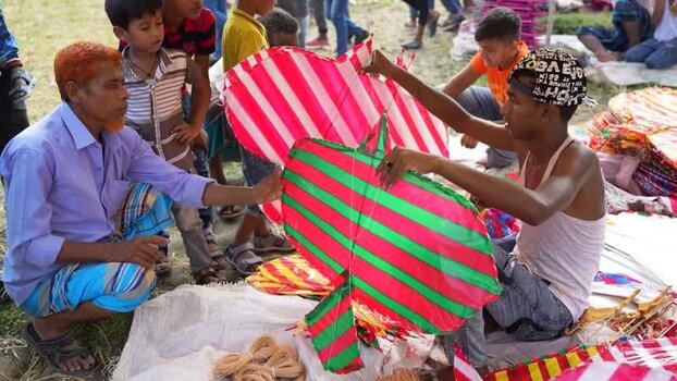 View of people selling colorful kites in Bogura Bangladesh. View of people selling colorful kites in Bogura Bangladesh.