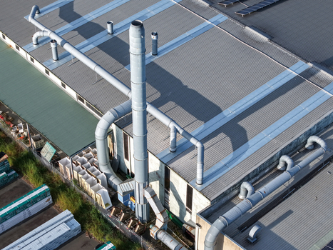Melbourne VIC Australia 22 September 2026 Aerial view of the industrial factory roof in Kilsyth featuring large ventilation ducts and an exhaust stack casting long shadows. Melbourne VIC Australia 22 September 2026 Aerial view of the industrial factory roof in Kilsyth featuring large ventilation ducts and an exhaust stack casting long shadows.