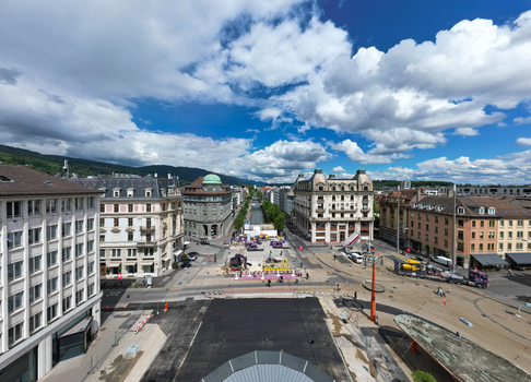 Aerial view of the central square and historic buildings with construction work and a canal under a cloudy blue sky in Biel Bienne Canton of Bern Switzerland. Aerial view of the central square and historic buildings with construction work and a canal under a cloudy blue sky in Biel Bienne Canton of Bern Switzerland.