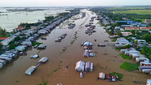 Aerial view of floating houses and boats on a river Vietnam.