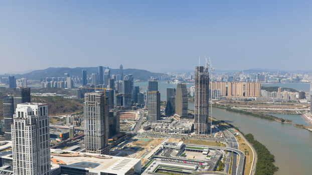 Macao 18 February 2026 Aerial view of the modern skyline of Macau Island featuring high rise buildings construction projects and a waterfront area under a clear sky. Macao 18 February 2026 Aerial view of the modern skyline of Macau Island featuring high rise buildings construction projects and a waterfront area under a clear sky.