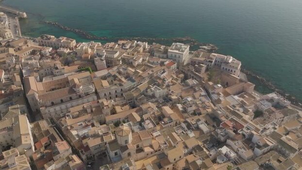 Aerial view of the Island of Ortigia and historic rooftops Italy. Aerial view of the Island of Ortigia and historic rooftops Italy.